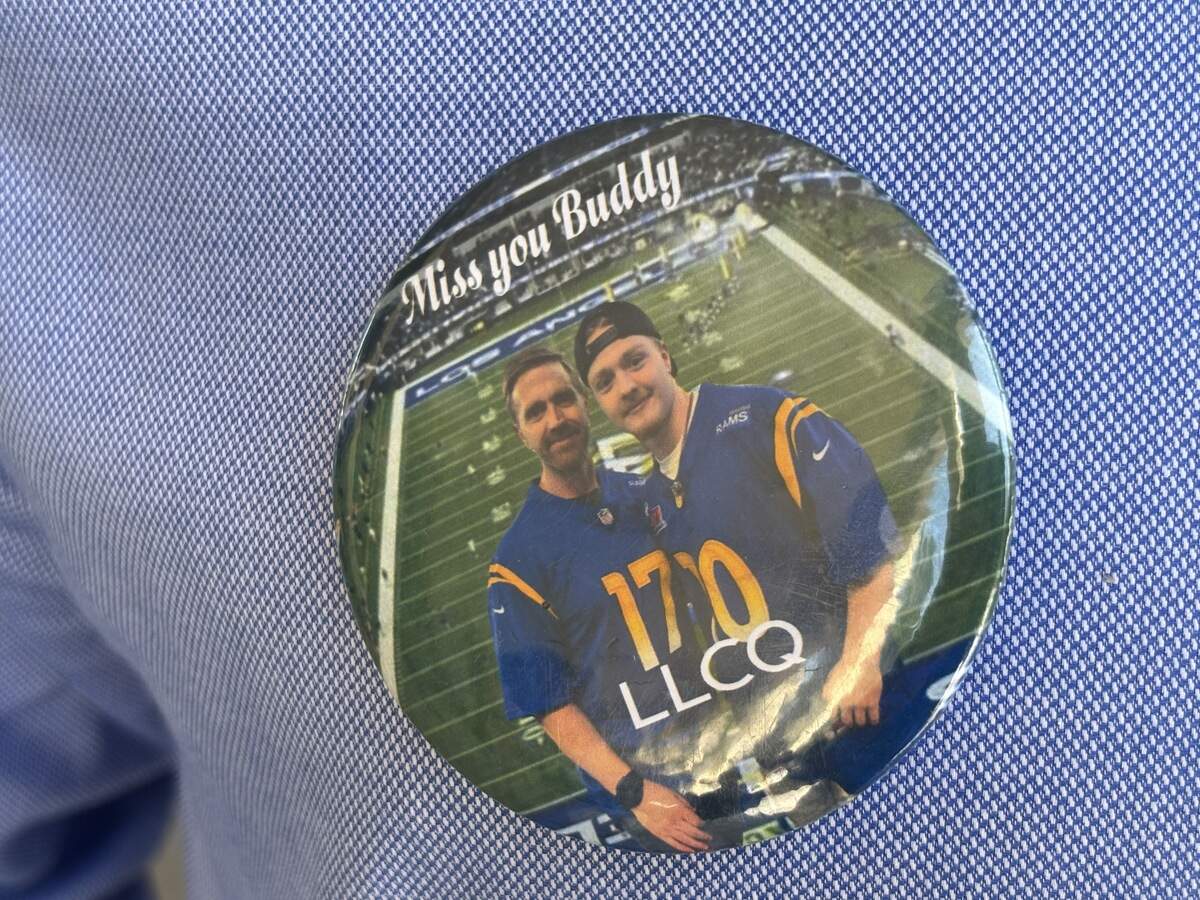 Stephen Quick wore a pin of himself and his son, Caleb, on Monday, Aug. 17, 2026, the same day the girl accused of murdering his son was found guilty. The photo was from a Los Angeles Rams game at SoFi Stadium from December 2024, months before Caleb was murdered in Clovis.